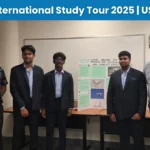 TIA Students standing with their project display board after a presentation.